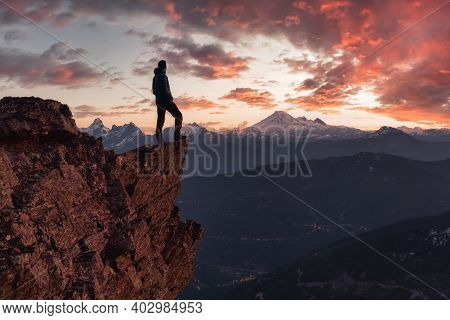 Adventurous Man Is Standing On Top Of The Mountain And Enjoying The Beautiful View. Taken On Top Of 