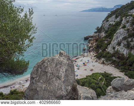 Aerial View Of Cala Fuili Beach Near Cala Gonone, Gulf Of Orosei, Sardinia Island, Italy. White Pebb