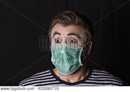 Young Male Mime Artist With Face Mask