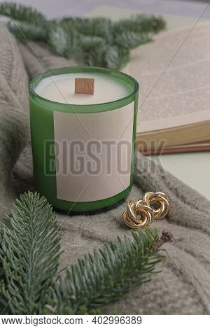Eco-friendly Soy Wax Candle In Recycled Glass Wine Bottle Candlestick. Nearby Lies A Decor Of Fir Br
