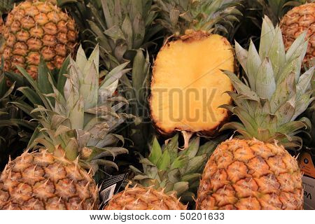 Pineapples cut open and displayed to show freshness