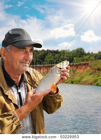 Chub In The Hand Of Fisherman