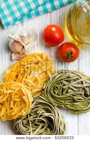 Italian pasta tagliatelle on kitchen table