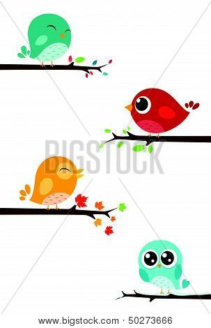 Birds sitting on branches
