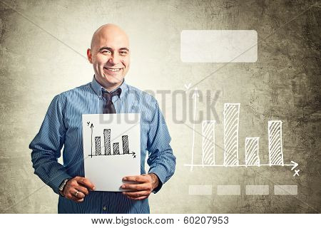 Businessman Holding Paper With Bar Chart Drawing