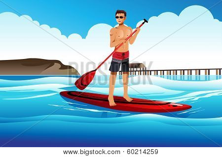 Man Paddle Boarding In The Ocean