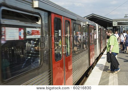 People Enter The Train At Baumwall U-bahn Station