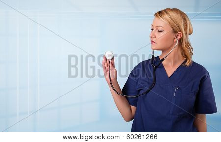 Pretty young nurse in hospital listening to empty copy space with sthetoscope
