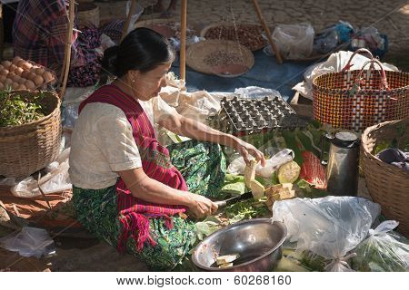 Burmese Woman Cut Vegetables On Asian Open Market