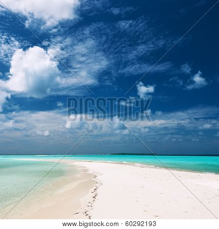 Beautiful island beach with sandspit at Maldives