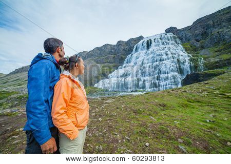 couple of tourists and Dynjandi. Iceland