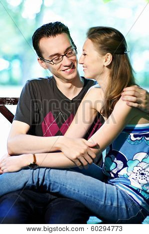 Girl With Boys On Park Bench