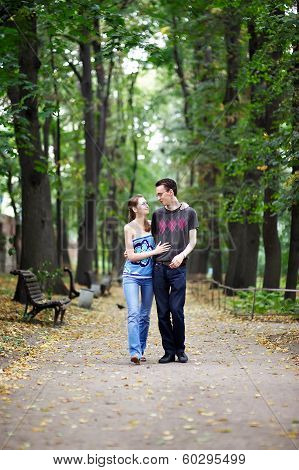 Man And Woman On A Walk In Park