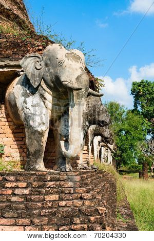 Elephants Statues On Ruins Of Buddhist Temple.