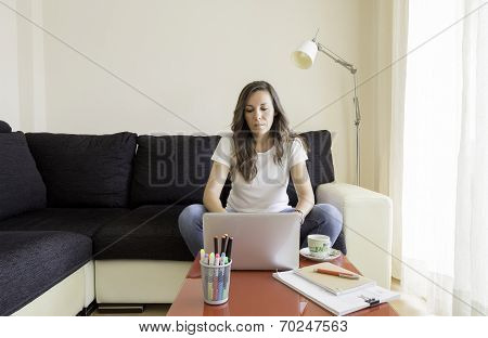 Young Woman Is Working At Home