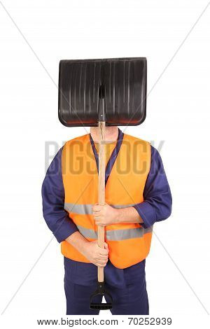 Worker in reflective waistcoat hiding face.