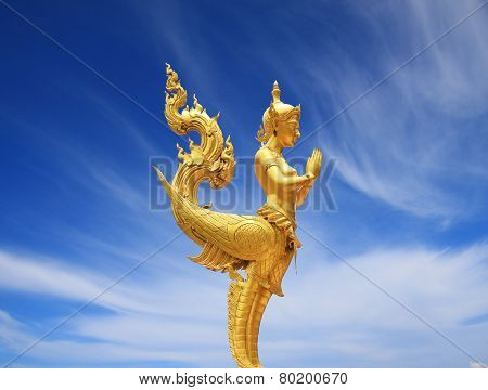 Sawasdee Golden Kinnari Statue With Blue Sky At Chainat Bird Park, Thailand On July 2014
