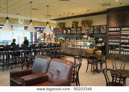 MOSCOW - SEP 24: Starbucks cafe interior in Sheremetyevo airport on September 24, 2014. Starbucks Corporation is an American global coffee company and coffeehouse chain based in Seattle, Washington