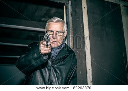 Dangerous Senior Aiming A Gun