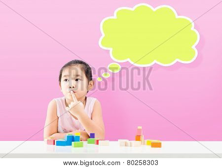 Thinking Little Girl With Empty Bubble And Wooden Building Blocks On Table