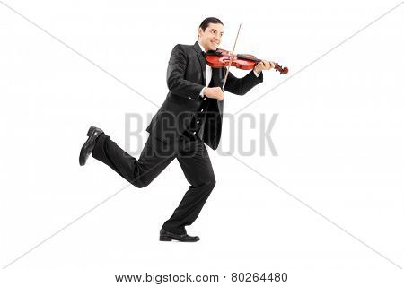 Full length portrait of a man running and playing a violin isolated on white background