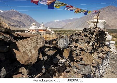 Stupa and player flags near Diskit monastery in Ladakh, Jammu & Kashmir, India - September 2014
