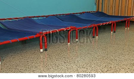 Small Beds Of A Dormitory Of Kindergarten Children