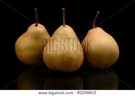 Three Pears Called Manon Isolated On Black