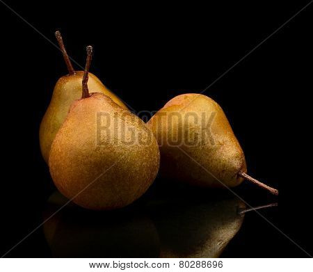 Three Pears Called Manon Isolated On Black