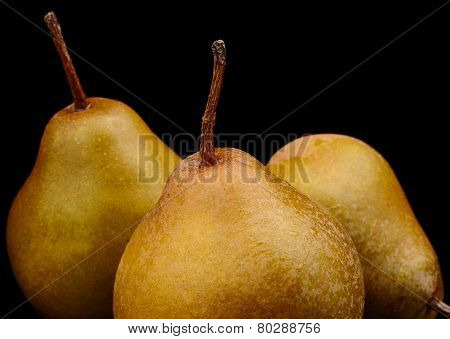 Three Pears Called Manon Isolated On Black