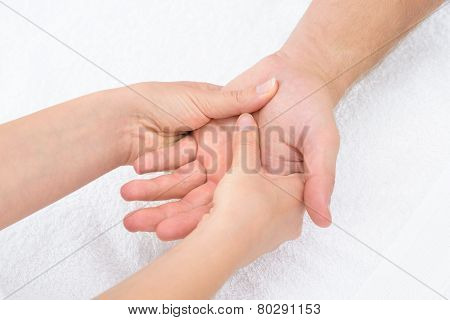 Physiotherapist Massaging Palm