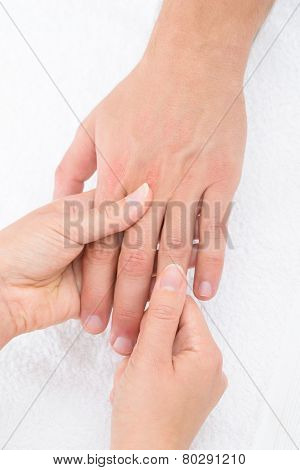 Physiotherapist Massaging Palm