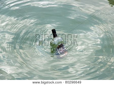 A bottle in the sea, bottle of empty alcohol in perdition