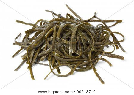 Soaked sea spaghetti on white background