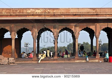 Group Of Worshipers Rest On Courtyard Of Jama Masjid Mosque In Delhi