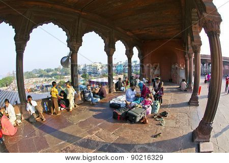 Group Of Worshipers Rest On Courtyard Of Jama Masjid Mosque In Delhi