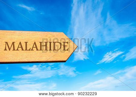 Wooden arrow sign pointing touristic destination