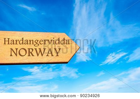 Wooden arrow sign pointing touristic destination