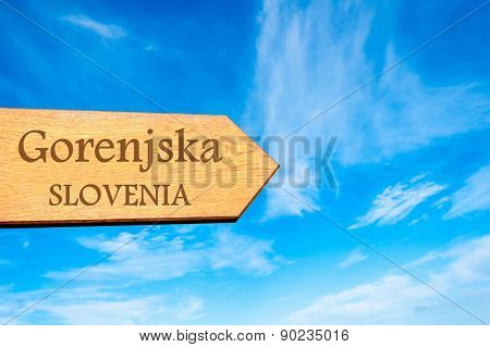 Wooden arrow sign pointing touristic destination