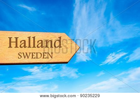 Wooden arrow sign pointing touristic destination