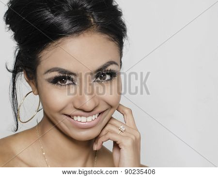 Beautiful young woman smiling wearing engagement ring