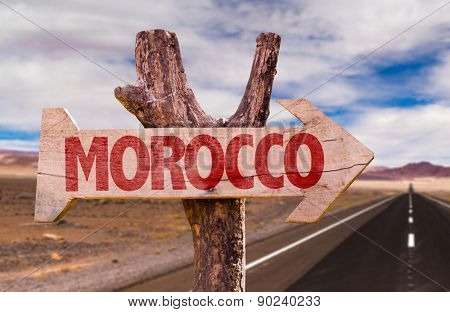 Morocco wooden sign with desert background