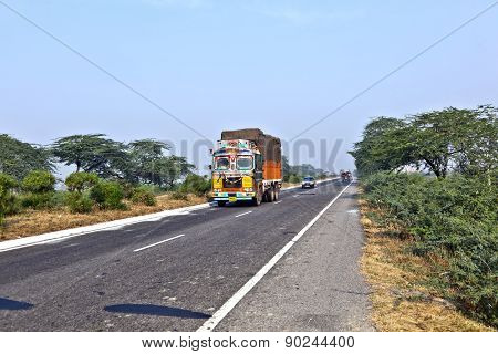 People In Overloaded Cars On The Highway Between Delhi And Agra