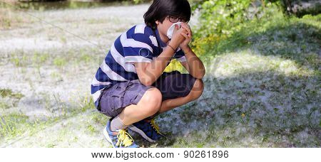 Young Boy With Pollen Allergy With Handkerchief