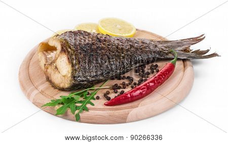 Fried carp tail with lemon and pepper.