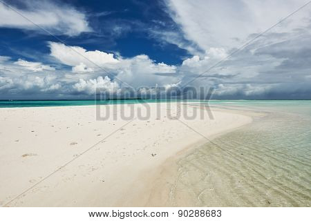 Beautiful island beach with sandspit at Maldives