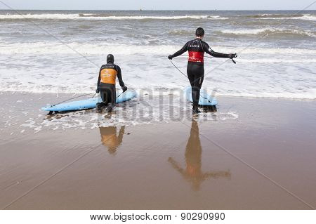 Instructor And Surfer On Scheveningen Beach