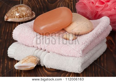 Soap, Towels. Sea Shells. Wooden Background