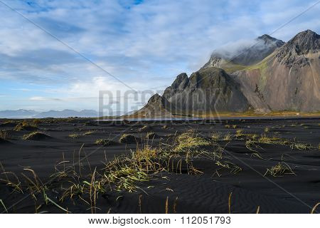 Mountains And Volcanic Lava Sand In Stokksness, Iceland