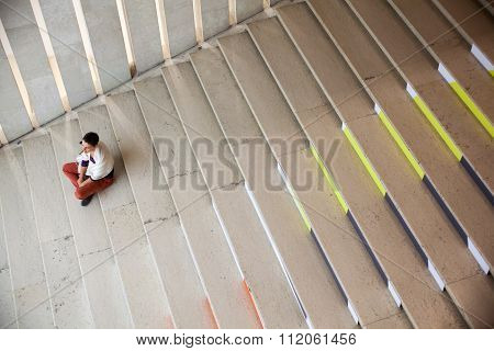 Girl Sitting On Staircase